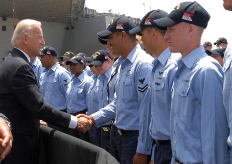 Vice President Joe Biden Shakes Hands On The Pier With Sailors From Nitmitz Class Aircraft