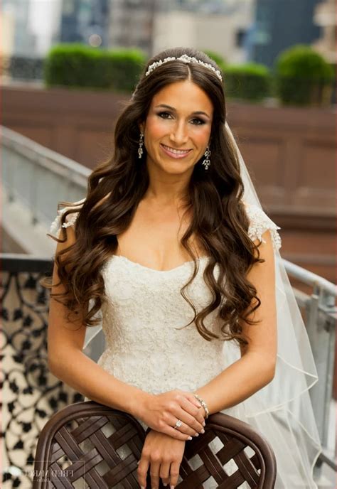 While straight hair and a wedding gown is still rather more of an oddity, you are far more likely to find brides embracing the longer hair styles and cutting down wearing the veil that covers up way more of her than most of them cares to. 15 Photo of Wedding Hairstyles For Long Hair Down With Veil