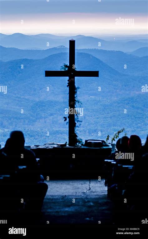 Christian Worship Cross Overlooking Mountains At Sunrise Stock Photo