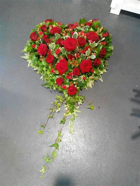 Our skilled florists may substitute flowers for one similar in style, quality and value. A stunning heart of red roses. A beautiful funeral tribute ...