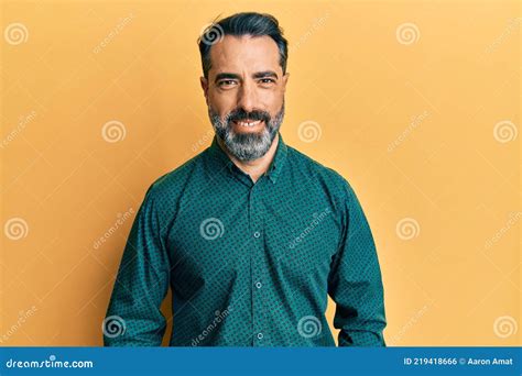 Middle Age Man With Beard And Grey Hair Wearing Business Clothes With A Happy And Cool Smile On