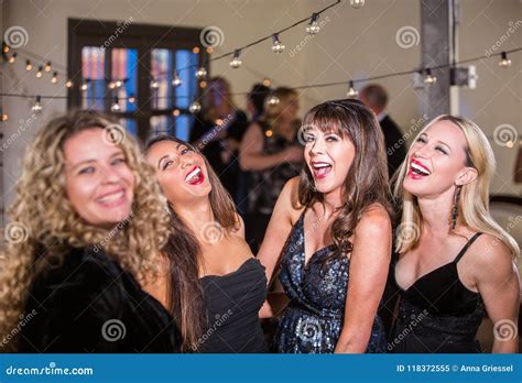 Four Women Laughing Loudly At A Party Stock Image Image Of Party