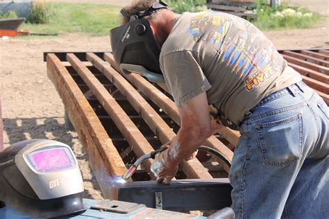 Building a cattle guard simply required digging a small hole, pouring a slab on either side, and putting a pipe or several pipes across the opening with gaps between them. Cattle Guard | Coteau des Prairies Lodge