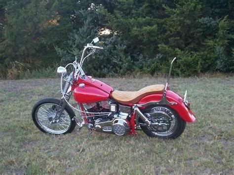 The first model was offered in one choice, metallic gray and an orange script. 1978 Harley-Davidson® FXE Super Glide® (Red Pearl), Ponca ...