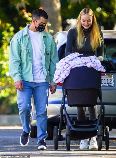 She looked pretty comfy in grey leggings, a crop top and plaid blazer. Sophie Turner gazes lovingly at her three-month-old baby ...