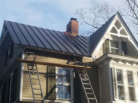 Black Matte Drexel Standing Seam Metal Roof Installation And Chimney