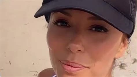 eva longoria 48 shows off her fit figure in a plunging white bikini on beach day in miami with