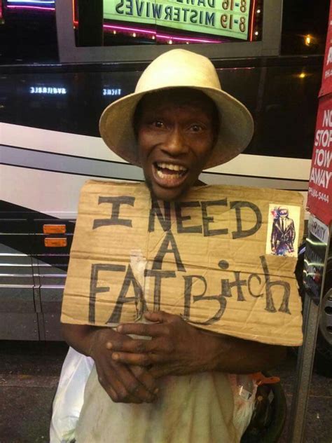 A Man Holding A Sign That Says I Need A Faith
