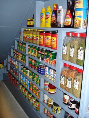 Storage pantries slide out from under the stairs to show off shelves that can house most any sized food items. 1000+ ideas about Under Stairs Pantry on Pinterest | Under ...