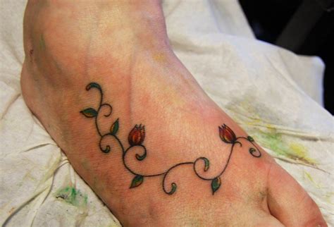 Some of the most commonly selected vine tattoos include the english ivy, the grapevine and flowers wrapped with a vine. Roses with Vines on feet | rose bud foot tattoo foot ...