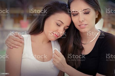 Young Woman Comforting Tearful Friend Stock Photo Download Image Now
