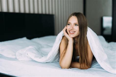 Beautiful Woman In Bed Under The Sheets At Home Stock Photo Image Of