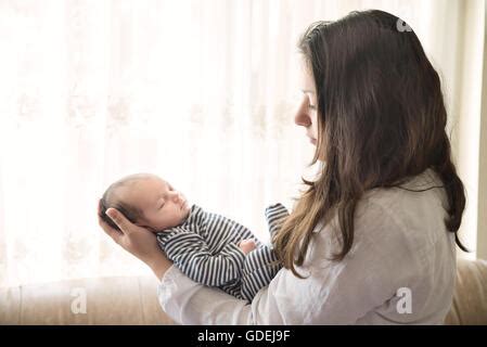 A Nude Mother Cradling Her Nude Infant Son Stock Photo Alamy