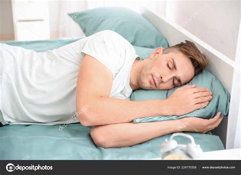 Handsome Man Sleeping Bed Home Stock Photo By ©serezniy 224770358
