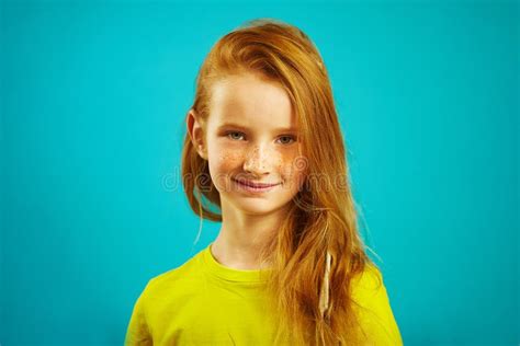 Portrait Of Cute Seven Years Old Girl With Red Hair And Beautiful