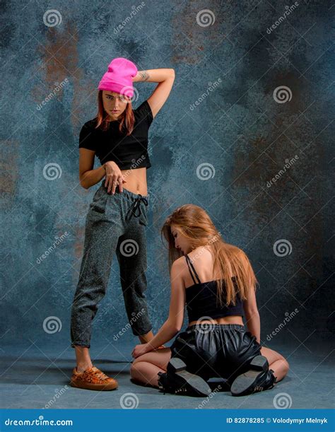 The Two Attractive Girls Dancing Twerk In The Studio Stock Image