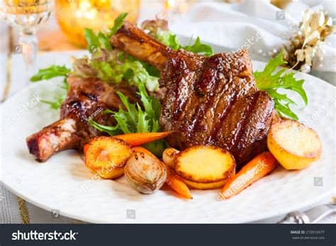 What was once common is preserved as special for christmas. Veal Chop With Vegetables For Christmas Dinner Stock Photo ...