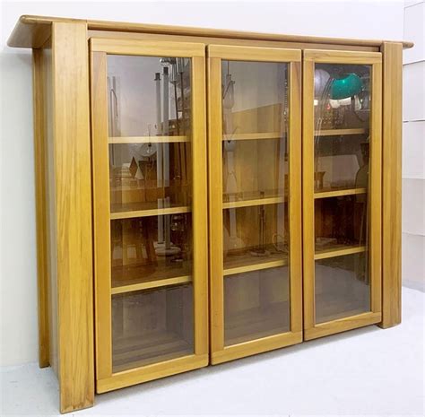 The kinds of cupboard front options are laminate and solid wood. Mario Marenco Walnut Display Cabinet, Italy, 1980 For Sale at 1stDibs