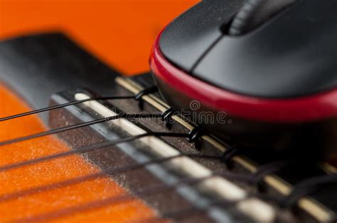 Computer Mouse And Guitar Isolated On White Background Stock Photo