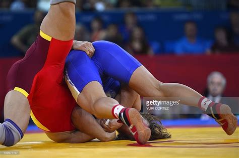 China S Jing Ruixue L Wrestles Russia S Lubov Volosova In Their Women S 63kg Freestyle