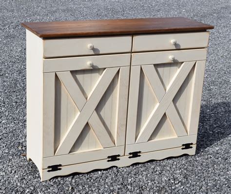 Once installed, you can simply pull the cabinet open and the trash can and basket will slide out. Double Trash Bin, Tilt Out trash can Cabinet, Rustic finish, Barn Door Model, Two 10 Gallon ...