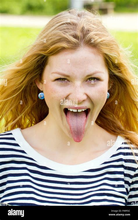 Young Woman Sticking Tongue Out Photo Stock Alamy