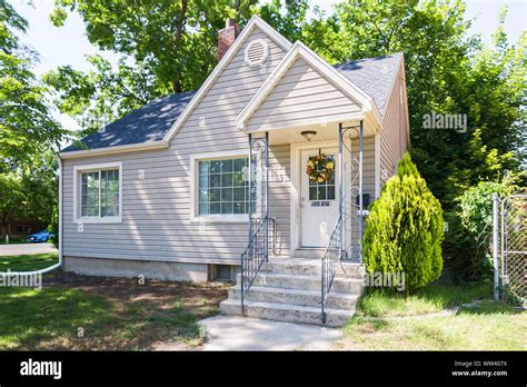 Sunny Shot Of Simple Tan House In Suburban Neighborhood Stock Photo Alamy