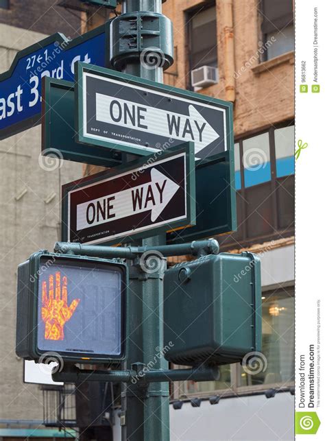 One Way Street Sign Pole In New York With Red Traffic Light Editorial