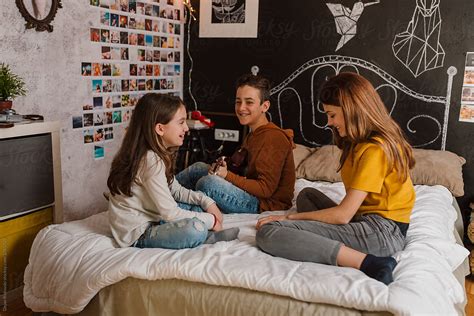View Teenagers Having Fun In Bedroom By Stocksy Contributor Dejan