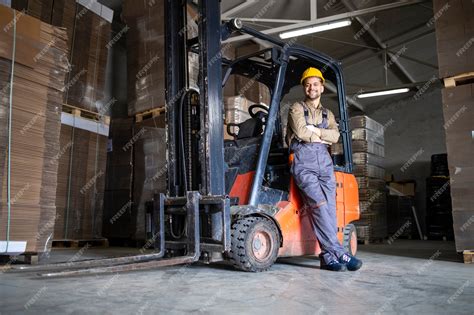 Premium Photo | Experienced forklift driver in warehouse storage room.