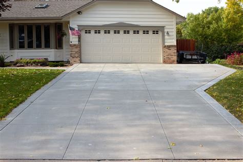 Gray Concrete Driveway With Gray Seamless Stamped Concrete Borders