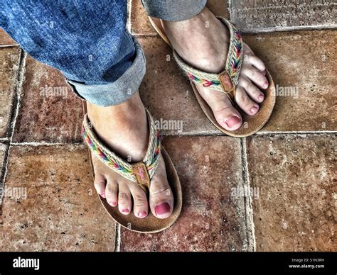 Womans Feet In Flipflops From Fatface High Angle View Stock Photo Alamy