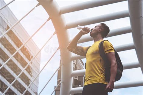 Sporty Guy Is Drinking Water In Hot Day Outdoor Stock Photo Image Of