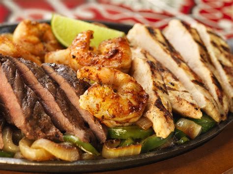 May be cooked to order. Fajita Trio: Grilled Steak, chicken and spicy garlic and ...