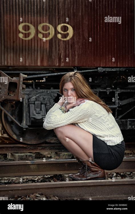 Young Female By Railroad Track And Train Stock Photo Alamy