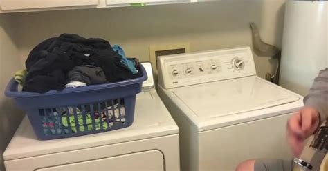 resourceful musician uses his own washing machine as perfect backing instrument to his guitar