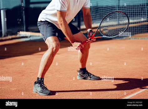 Tennis Player Standing In Ready Position On Tennis Court Stock Photo