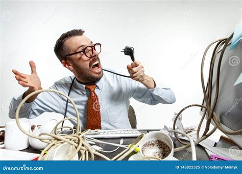 Young Man Tangled In Wires On The Workplace Stock Image Image Of