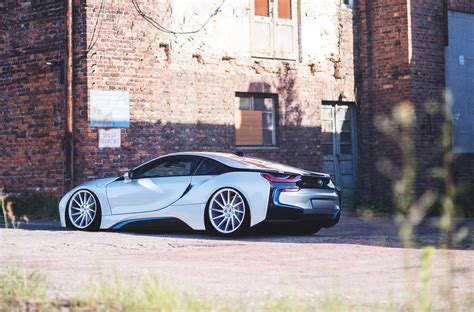Signature blue trim was wrapped along with the body of the car as the owner was after the all black look. Gaudy White BMW i8 Gets Upgraded