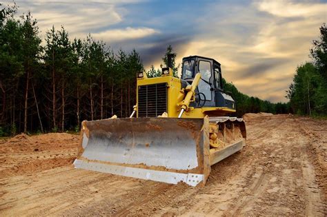 Earth Moving Equipment Land Clearing Road Work Sunset Background