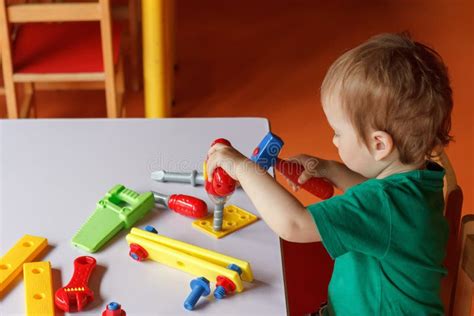 Little Boy The Child Plays With Blocks And Toys Stock Image Image Of