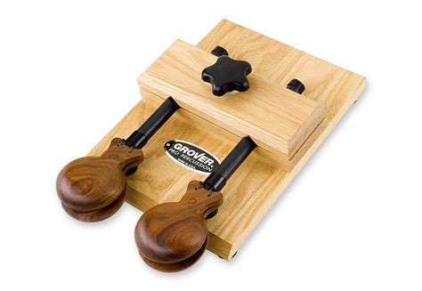 The instrument consists of a pair of concave shells joined on one edge by a string. Castanet Mounting Frame
