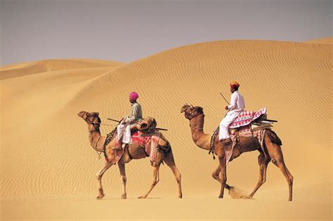 Two Men On Camelback In Desert Jaiselmer India546003 Urban Wired