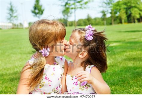 Little Sisters Kissing Each Other Stock Photo Edit Now 97470077