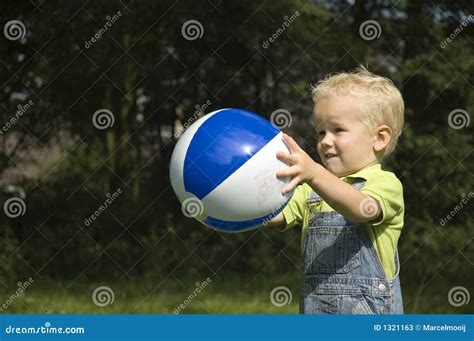 Child Catching A Ball
