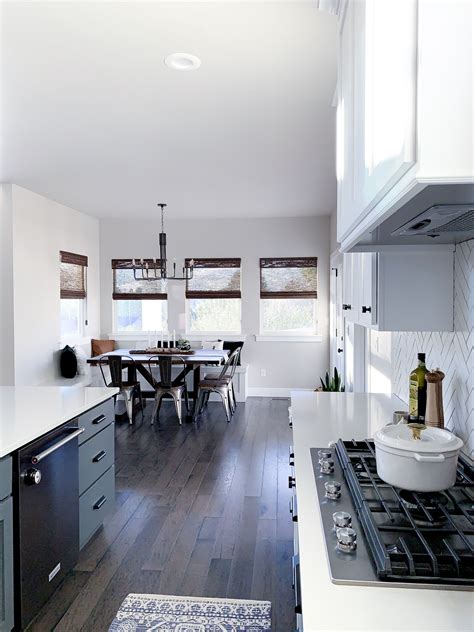 Modern farmhouse kitchen with antique brass accents, mainly lighting fixtures. Two Tone Kitchen Cabinets | Modern farmhouse kitchens ...