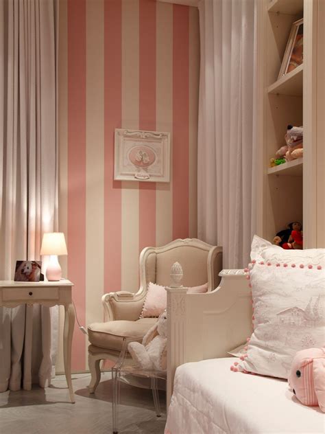 Horizontal wood planking visually tricks the eye in this bedroom, making the room appear wider than it is. Portfolio of Properties | Striped walls bedroom, Pink ...