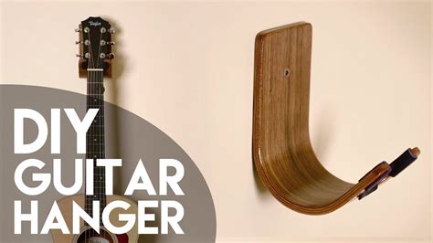 Use the holes as a template and mark where you'll be drilling. DIY Guitar Hanger // Bent Wood Lamination How To ...