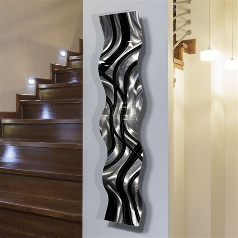 Large metal wall decor an easy way to decorate a bland space. Shop Statements2000 Black/Silver Abstract Metal Wall Art Accent Sculpture Decor by Jon Allen ...