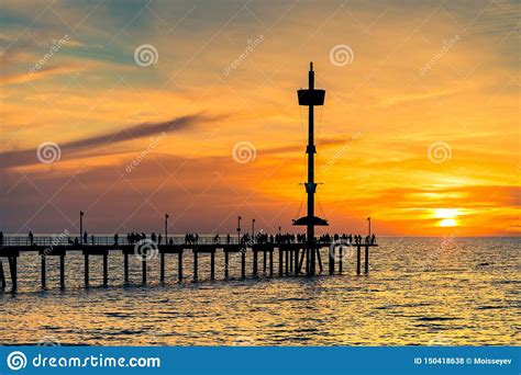 People Silhouettes On Brighton Jetty At Sunset Stock Photo Image Of Pier Clouds 150418638